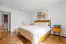 Hardwood flooring, recessed lighting, crown molding, double-door closet, and wainscoting