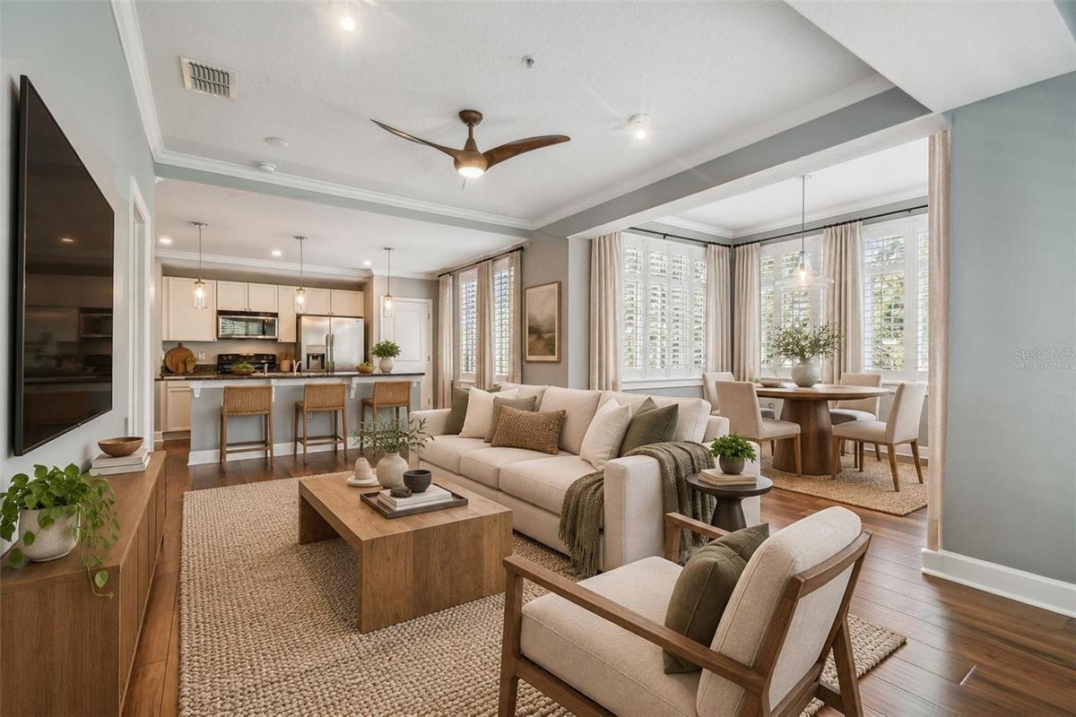 Virtually staged photos of living/dining combo with an abundance of natural light.