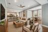 Virtually staged photos of living/dining combo with an abundance of natural light.