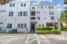 Rear view of condo building from the covered parking area.