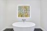 Bathroom with a washtub