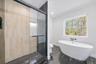 Bathroom featuring toilet and shower with separate bathtub