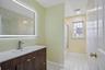 Main bathroom with new sink, mirror and toilet