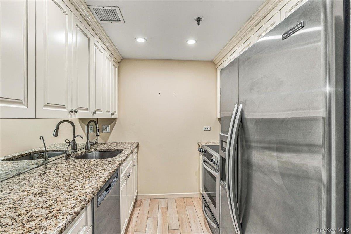 Updated Galley Kitchen with Stainless Steel Appliances