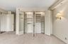 Primary Bedroom Closet with Custom Closet System