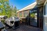 Open Deck featuring wood-finish decking just off the screened-in porch area
