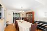 Hardwood flooring, sliding glass door, pendant light fixture, and a built-in display cabinet
