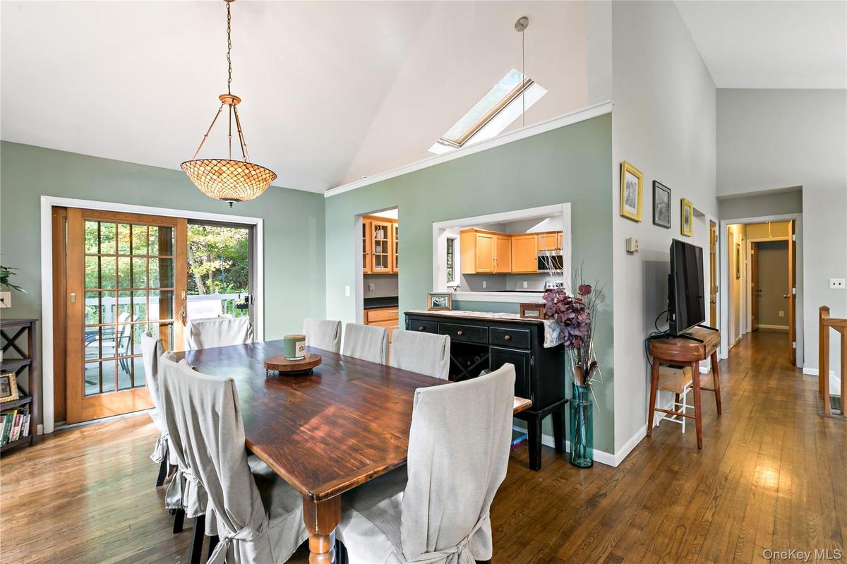 Formal dining room with sliders out to deck.