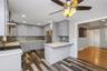 First floor renovated kitchen with quartz counter tops and stainless steel appliances.