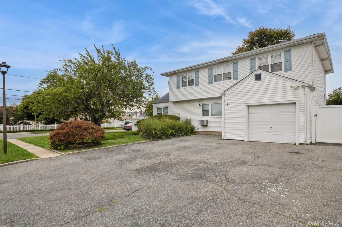 Corner property with plenty of yard space in the front, side and back.