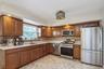 Second floor large kitchen with new stainless steel appliances and huge pantry room.