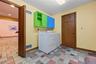 Laundry room behind the kitchen.  Door on right is the powder room