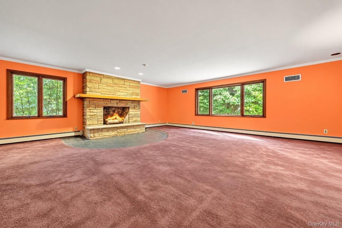 Stone fireplace with raised hearth