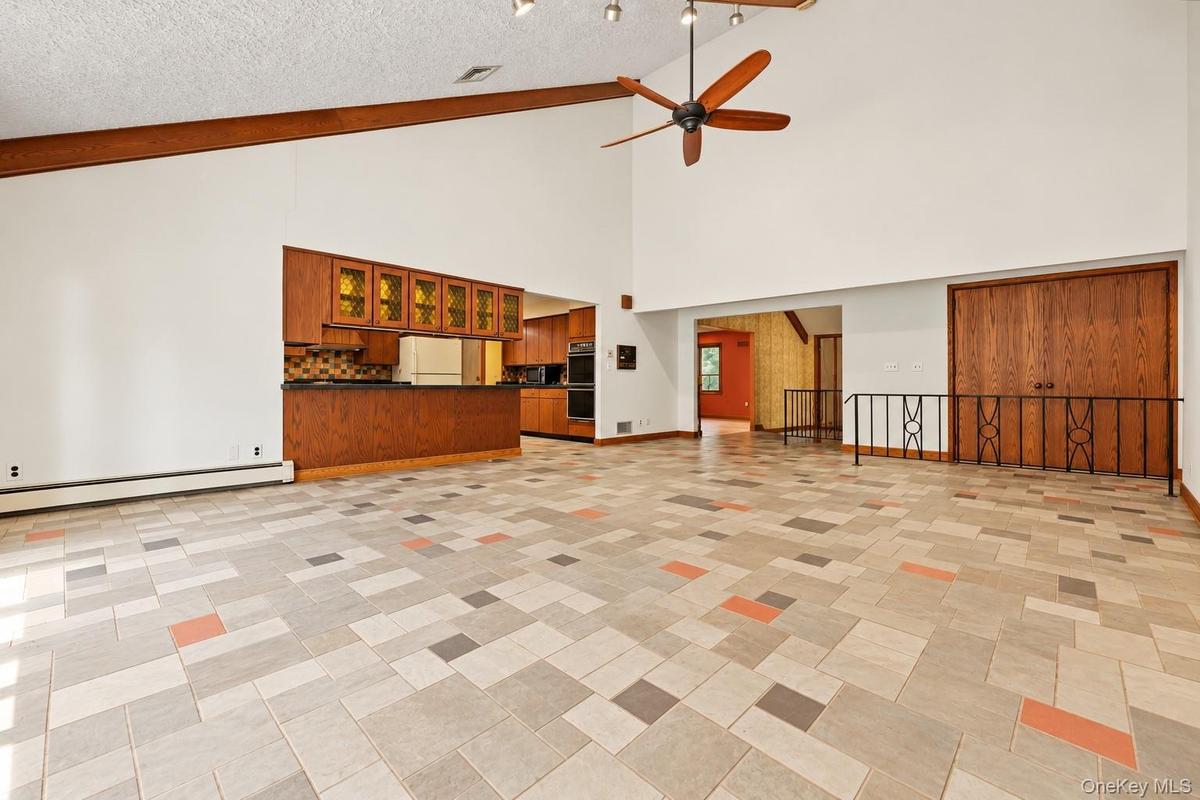 Another view with kitchen on the left, hallway and living room.