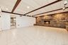 Another view of the family room looking into the summer kitchen.Extraneous objects removed.
