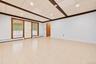 Great space for an office.  Exterior door leads to patio and doorway leads to summer kitchen.  Extraneous objects removed.