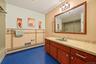 Hall bath for bedroom 2 and bedroom 3.  Extraneous objects removed