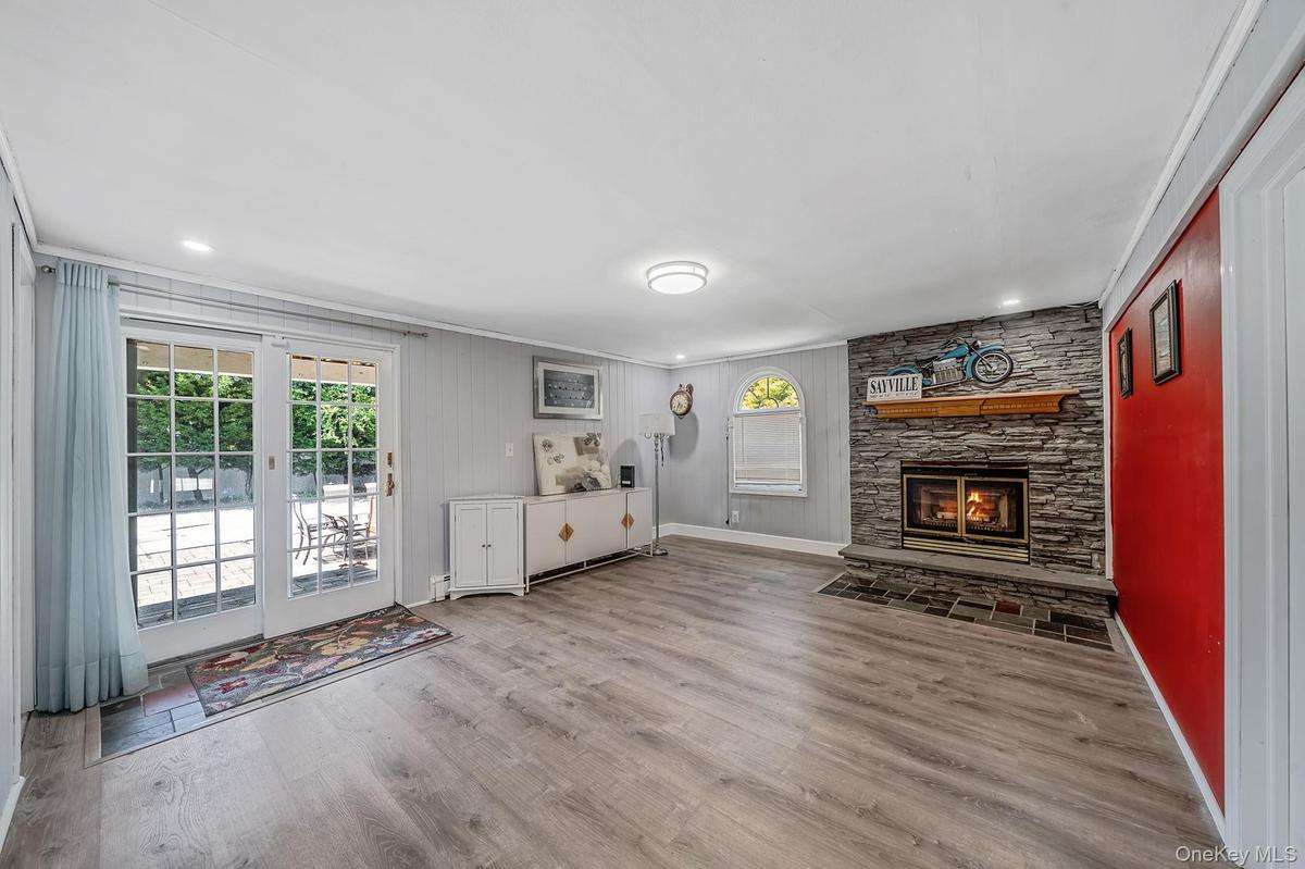 Lower Level Family Room/Den with Fireplace
