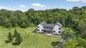 View from above of property with a heavily wooded area