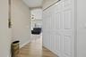Foyer leading to family room and kitchen