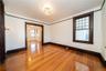 Formal Living Room with high ceilings, refinished hardwood floors throughout and freshly painted.