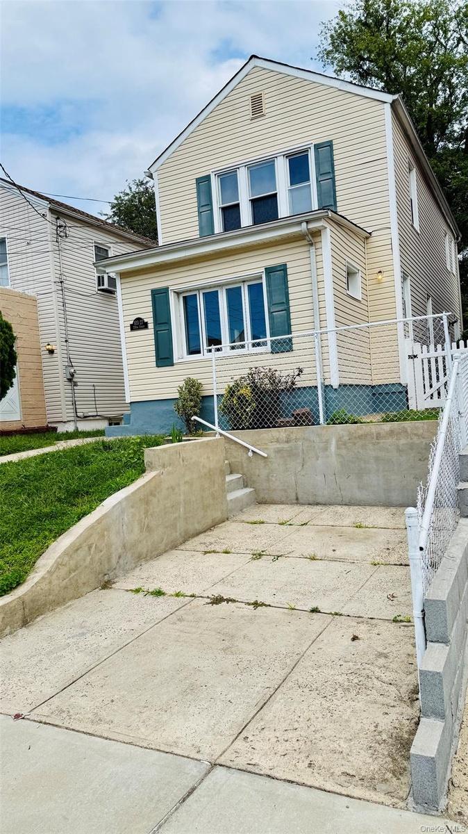 Front of the house including parking spot