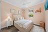 Another Queen Bed, TV and a stunning view of the back yard + Tiki Hut!