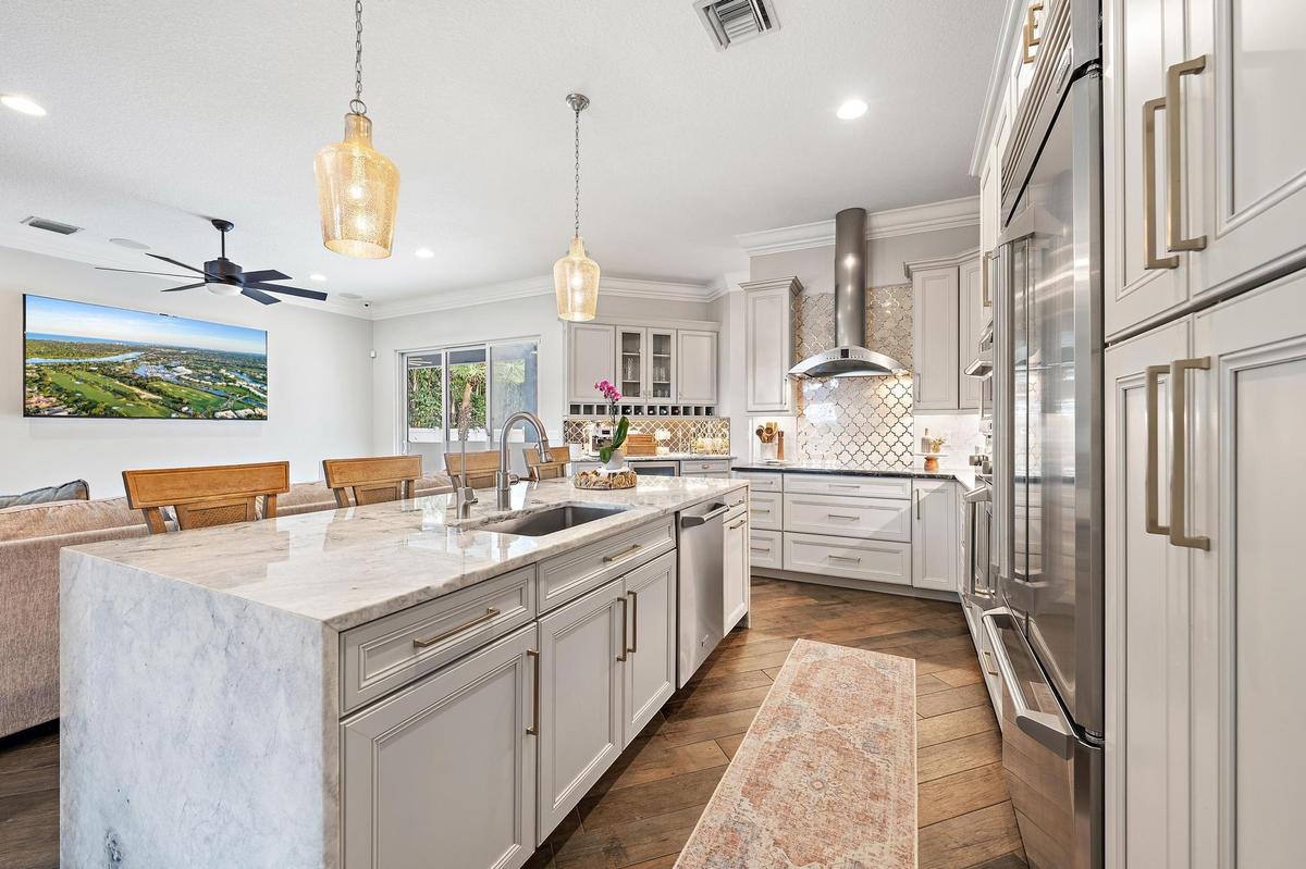 Elevated soft close cabinetry and finishes are perfectly accented by GE Monogram Appliances.