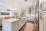 Elevated soft close cabinetry and finishes are perfectly accented by GE Monogram Appliances.