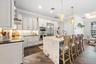 Complete with Waterfall Island, Marble and Natural Stone Countertops, Seating for 4 and so much more!