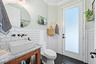 Enjoy direct pool access from this half bath which is an en-suite with Bedroom #4.