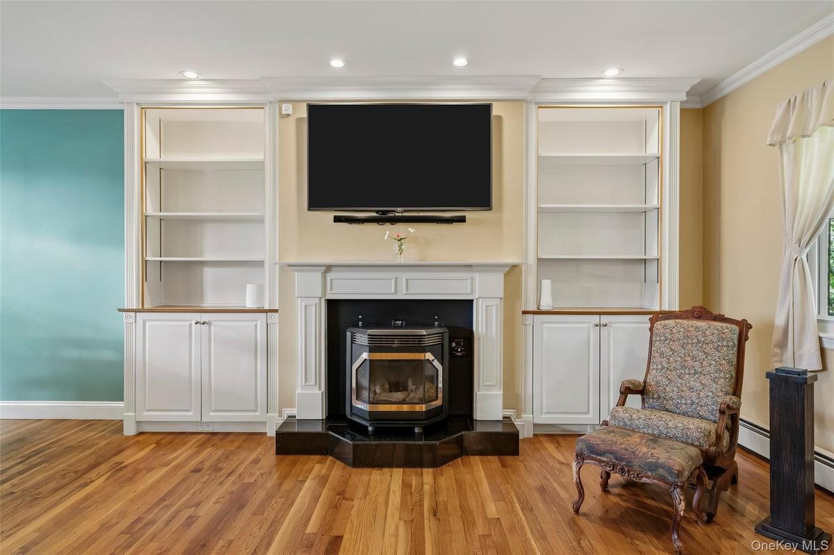 Beautiful custom built-ins, hardwood floors and crown molding