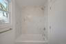 Full bath featuring tub / shower combination