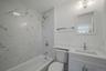 Full bath featuring vanity, toilet, and shower / bath combination