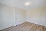 Unfurnished room featuring baseboards and light wood-type flooring