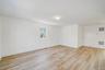 Empty room with light wood-type flooring and baseboards