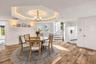 Dining with cove lighting and custom Millwork