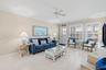 Recessed lighting, wood-finish flooring, ceiling fan, crown molding, and plantation shutters