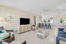 Bright open-concept living area with light wood-look flooring