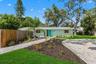 Welcome home to OZONA! A NEW ROOF (2024), cheerful coastal exterior, expansive driveway, and gated access to the fully fenced pool area set the stage 