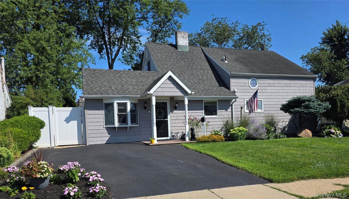 Lovely curb appeal with and  newly sealed driveway!
