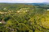 Most of the property acreage is inside the outline.  Looking east
