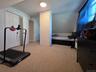 Bedroom 3 - Freshly painted in 2026 - 1 A/C window unit - closet with scuttle attic access for extra storage - carpet