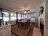 Dining Room with Wall of Windows overlooking the backyard.