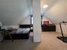 Bedroom 3 - Freshly painted in 2026 - 1 A/C window unit - closet with scuttle attic access for extra storage - carpet