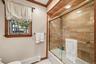 Tub with glass enclosure