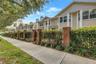 Tree-lined streetscape highlights the distinctive architecture and intimate residential setting of The Huntington.