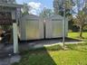 two Aluminum storage buildings.