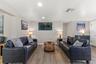 Spacious main living area with luxury vinyl plank flooring and an open layout that connects easily to the kitchen and dining spaces.