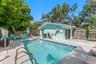 Another view of the private pool and fully fenced outdoor space, with direct access to the home.